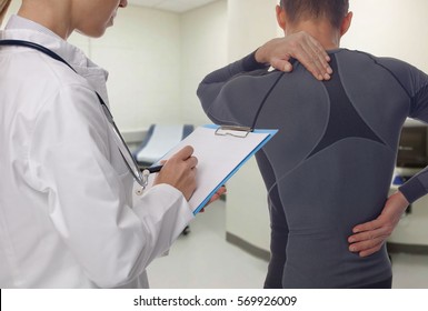 Chiropractic, Osteopathy, Physiotherapy, Sport Injury Rehabilitation. Alternative Medicine, Pain Relief Concept. Man Patient Suffering From Back Pain During Medical Exam.