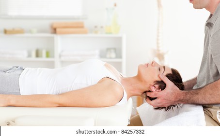 Chiropractor Stretching A Cute Woman In A Room