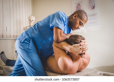 A Chiropractor Treating A Young Boy