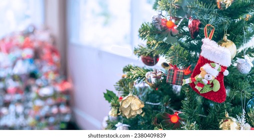 Chirtmas decoration Christmas tree with many different decorations and festival interior in living room. New Year celebration concept