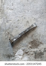 Chisel on concrete slab. Very old construction tool. Renovation of old premises. Preparing for repair work of home. Workplace