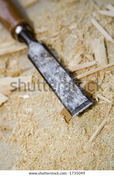 A chisel in a
pile of debris on a worksite