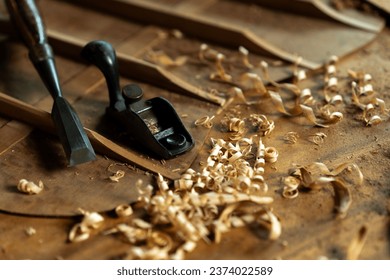 chisel and planer on the bracing of acoustic guitar. Luthier carefully working to ensure that braces are the correct shape and size for optimal sound