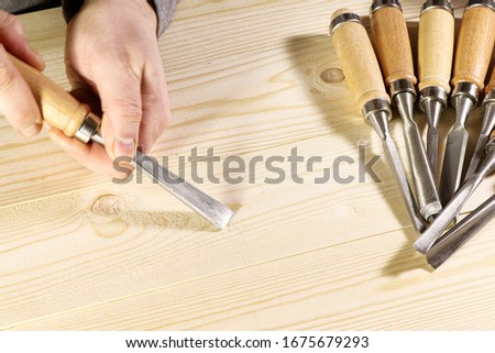 Chisels. Assortment of chisel of wood for carpentry. Hand holding chisel.