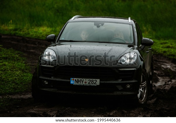 CHISINAU,\
MOLDOVA - JUNE 17, 2021: Porsche Macan S in off-road full of mood\
on bad road in Moldova. Editorial\
photo.
