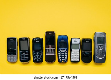 Chisinau, Moldova - June 2, 2020: Collection Of Old Nokia Mobile Phones On Yellow Background.