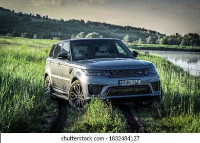 Chisinau, Moldova - June 27 2020: Land Rover Range Rover Sport Phev In Green Field