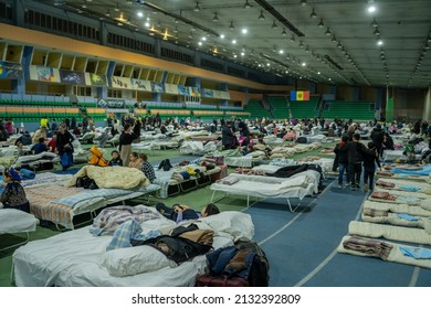 chisinau, moldova - march 4 2022: chisinau arena refugee center with a lot of people and folding beds fow ukrainian refugees