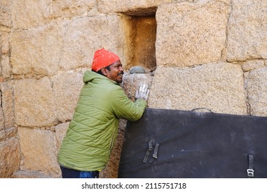 Chitradurga, Karnataka, India - 30 Jan 2022: A selective focus of face of the famous Indian wall climber named Jyoti Raj, also known as Kothi Raj(Raju or Raja). The right hand is blurred due to motion