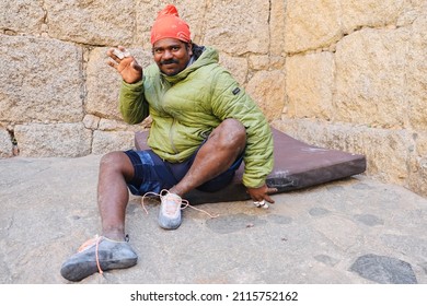 Chitradurga, Karnataka, India - 30 Jan 2022: A selective focus of face of the famous Indian wall climber named Jyoti Raj, also known as Kothi Raj(Raju or Raja) getting ready for climbing.