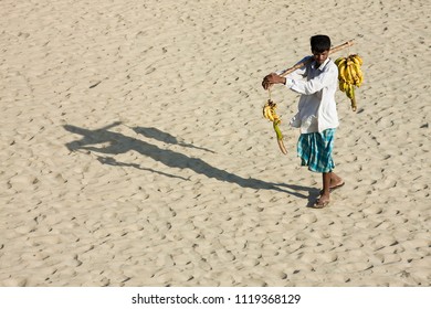 Chittagong, Bangladesh - 06 16 2009: Banana seller at the beach
