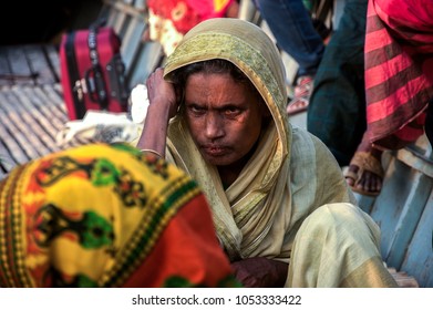 Chittagong, Bangladesh, 6 December 2017: A Picture Of An Old Rohingya Woman Crossing A River Hiding Herself In A Boat Beside A Rural Area Near Chittagong City In Bangladesh. This Picture Was Taken At 