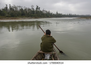Chitwan, Nepal - 21 January 2020: tourists on a canoe safari at Chitwan national park on Nepal