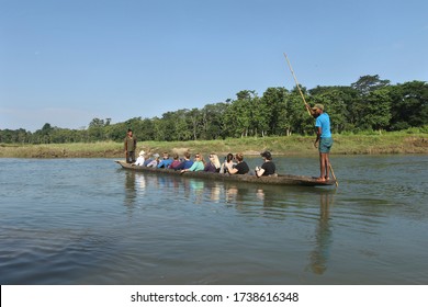 CHITWAN, NEPAL - OCTOBER 20, 2016: Tourists having fun during boating in Rapti River.