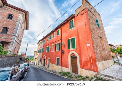 Chiusi, Italy Small Historic Town Village City In Tuscany With Colorful Red House Building During Summer And Sign For Via Della Villetta And Nobody