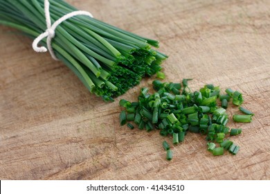 Chives on a wooden surface - Powered by Shutterstock