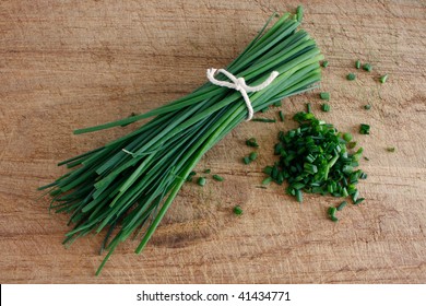 Chives on a wooden surface - Powered by Shutterstock