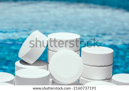 Chlorine for pool maintenance. Chlorine powder or tablets is the most common disinfectant for pool water a very effective solution and it is a chemical product. Chlorine for pool. pool pills. close up