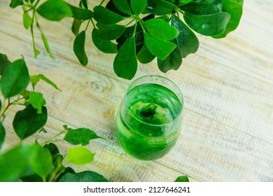 Chlorophyll Supplement In A Glass Of Water. Selective Focus. Nature.