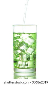 Chlorophyll Water Is Poured Into A Glass With Ice Cubes