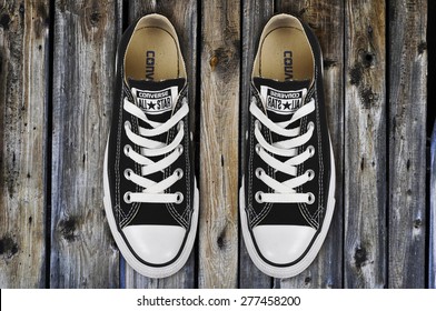 CHLUMCANY, CZECH REPUBLIC, MARCH 27, 2015: Black Low Converse Shoes On Wooden Planks