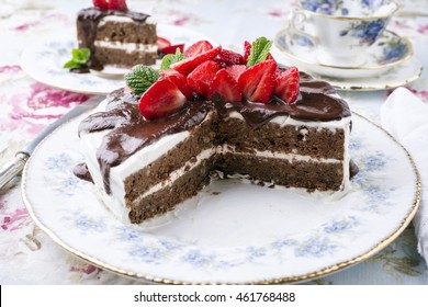 Choco Nuts Cake With Strawberries On Plate