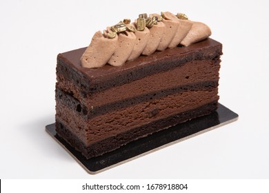 Choco Piece Of Cake Cooking Brown On A White Background