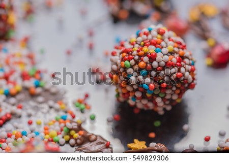 Similar – Dot on chocolate Candy