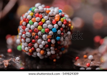 Similar – Dot on chocolate Candy