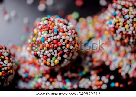 Similar – Dot on chocolate Candy