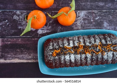 Chocolate Almond Clementine Cake Garnish With Powdered Sugar And Zest