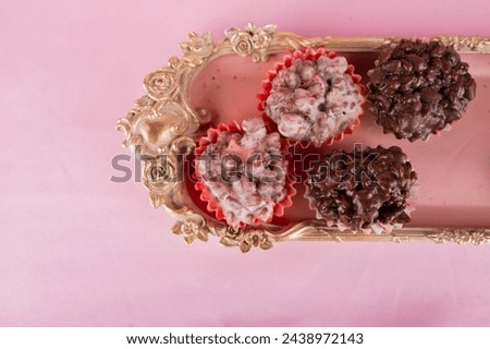 Chocolate and almonds in pink background Zdjęcia stock © 