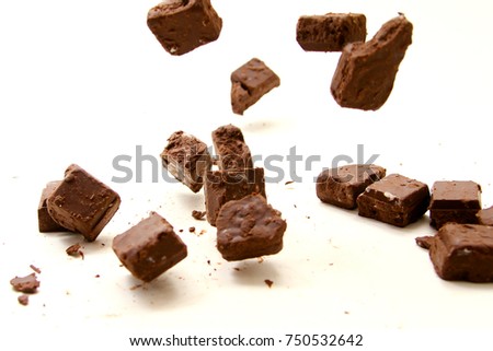 Chocolate background / A chocolate bar is a chocolate confection in an rectangular form distinguishes it from bulk chocolate produced for commercial use or individually portioned chocolates 