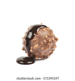 Chocolate Ball Confection Candy Spilled With The Hot Choco Syrup Isolated Over The White Background