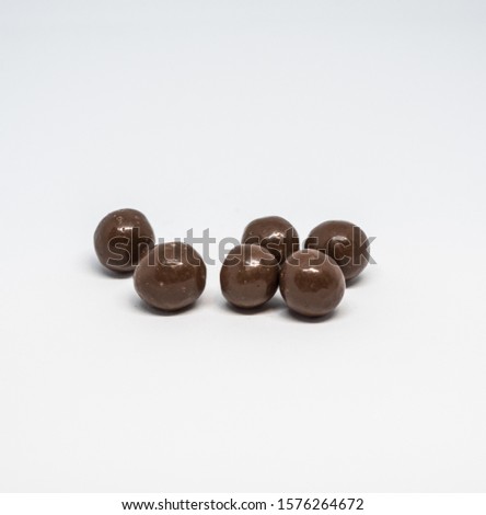 Chocolate balls loose, isolated on the white background.