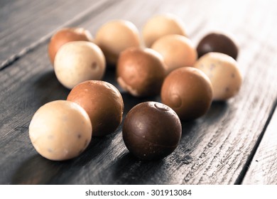 Chocolate Balls On Wood Background