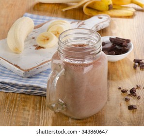 Chocolate banana smoothie in jar. Selective focus