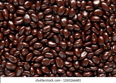 Chocolate Beans With Raisin Close Up, Background, Texture.