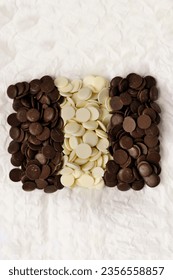 A chocolate beans. white, milk and dark chocolate. white background. delicious dessert - Shutterstock ID 2356558857