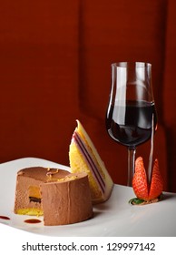 Chocolate And Berries Cake With Glass Of Dessert Wine