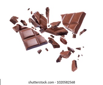 Chocolate broken into pieces in the air on a white background