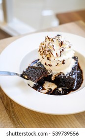 Chocolate Brownie Cake With Hot Fudge And Vanilla Ice Cream