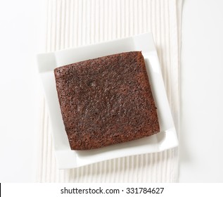 Chocolate Brownie Cake On White Square Plate