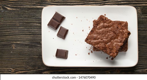 Chocolate Brownie Cake Served On Rectangle Plate. Top View With Copy Space