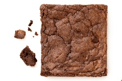 Chocolate Brownie With Chocolate Chips Next To Crumbs Isolated On White. Top View.