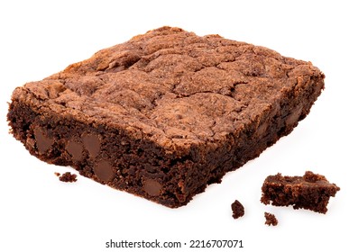 Chocolate Brownie With Chocolate Chips Next To Crumbs Isolated On White.