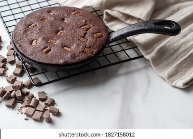 Chocolate Brownie Cookie Cooked In A Cast Iron Skillet