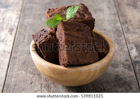 Similar – Chocolate brownie pieces on wooden background