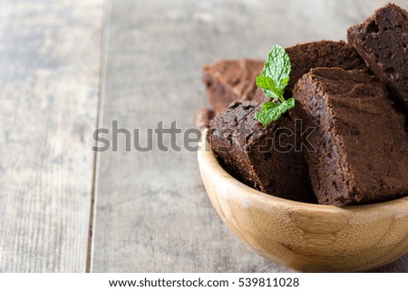 Similar – Chocolate brownie pieces on wooden background