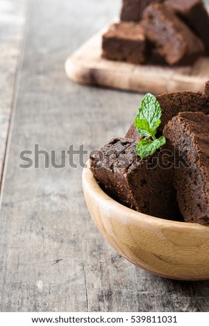 Similar – Chocolate brownie pieces on wooden background